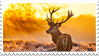a deviantart stamp with a photo of an elk in a yellow landscape